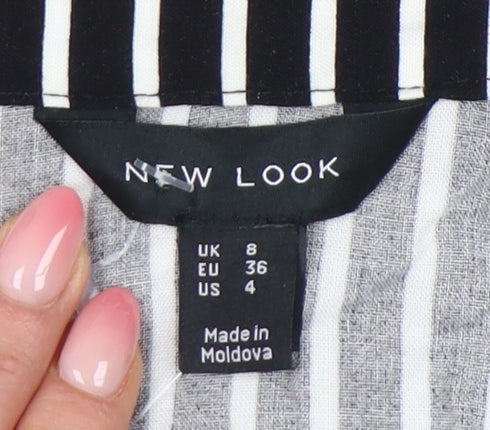 Brand and care label for New Look Women's Black Striped Wrap Dress, size 8