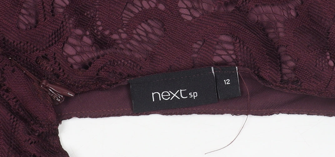 Brand and care label for Next Women's Purple Lace Knee Length Sheath Dress, size 12
