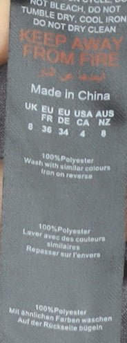 Brand and care label for PRETTYLITTLETHING Women's Grey Halter Bodycon Dress, size 8