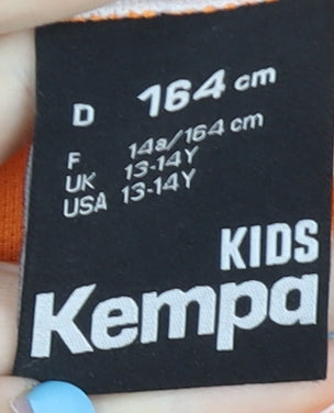 Brand and care label for Kempa boys’ orange football jersey 13-14y short sleeve