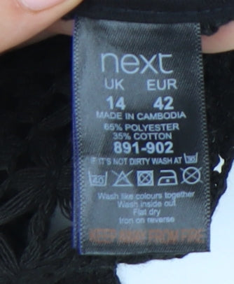 Close-up detail of Next Women's Black Crochet Blouse, size 14