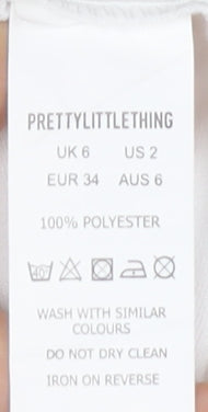 Close-up detail of PRETTYLITTLETHING Women's White Bodycon Dress, size 6