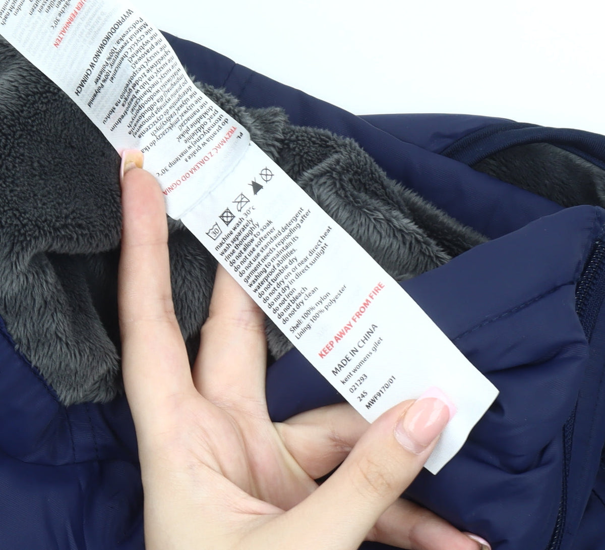 Brand and care label for Mountain Warehouse Women's Blue Hooded Puffer Waistcoat, size 12