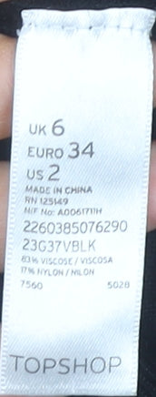 Close-up detail of Topshop Women's Black Sequin Striped jumper, size 6