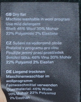Brand and care label for Weekday Women's XS Green Knit jumper