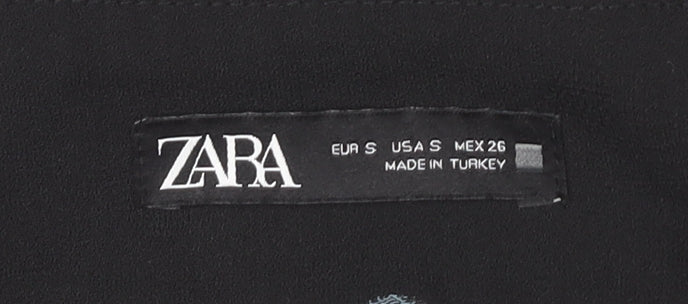 Brand and care label for Zara Women's Black Polka Dot Cropped Trousers