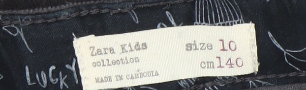 Brand and care label for Zara Kids girls’ black corduroy paperbag shorts age 10 years 140cm