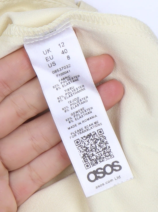Brand and care label for ASOS women’s beige cargo trousers, size UK 12, straight leg pockets