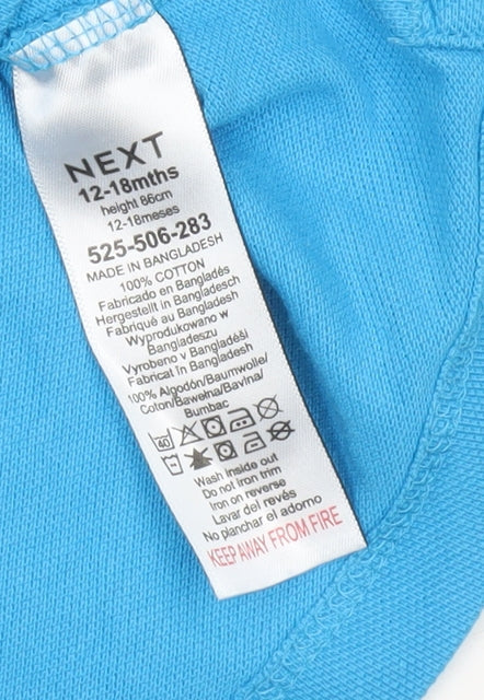 Brand and care label for Next boys’ blue polo shirt 12-18 months cotton short sleeve casual top