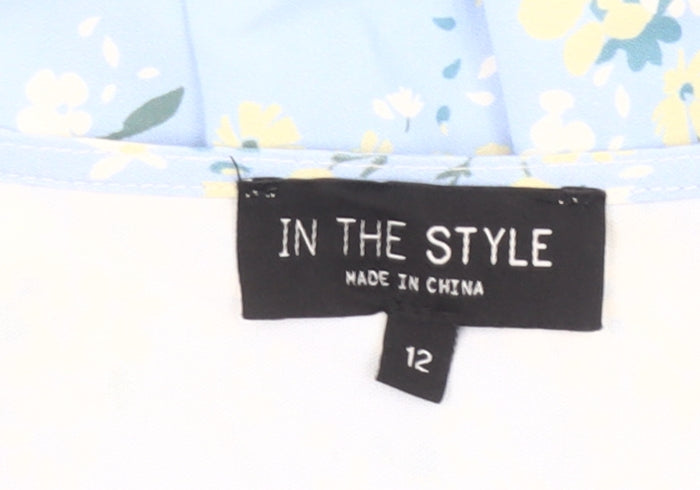 Brand and care label for In The Style Women’s Blue Floral Skater Dress, size UK 12, V-Neck