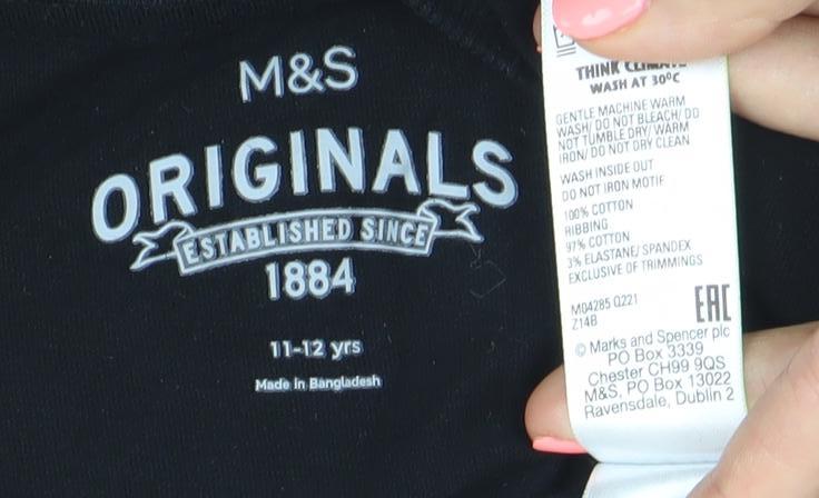 Brand and care label for Marks & Spencer girls’ black graphic long sleeve t-shirt 11-12 years