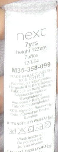 Brand and care label for Next girls’ white dance graphic t-shirt age 7 years cotton short sleeve