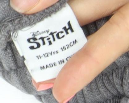 Brand and care label for Disney Stitch boys’ grey joggers 11-12 years elastic waist fleece sweatpants