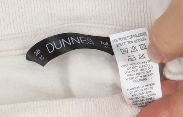 Brand and care label for Dunnes Women Beige XS Graphic Paris Print Pullover Sweatshirt