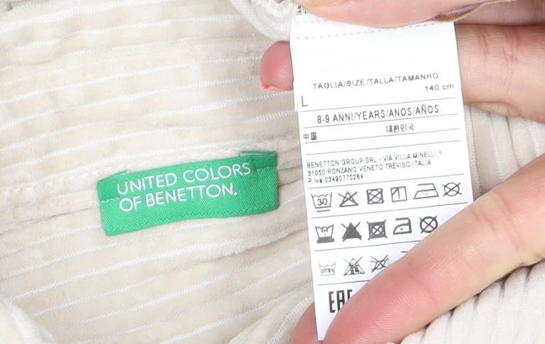 Brand and care label for United Colors of Benetton girls’ beige cotton corduroy shirt jacket 8 years