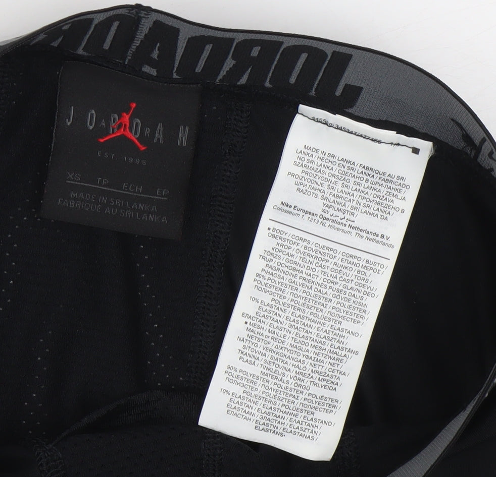 Brand and care label for Jordan boys’ black xs compression dri-fit sports leggings