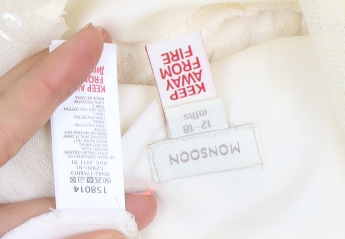 Brand and care label for Monsoon girls’ ivory tutu dress 12-18 months lined party wedding dress