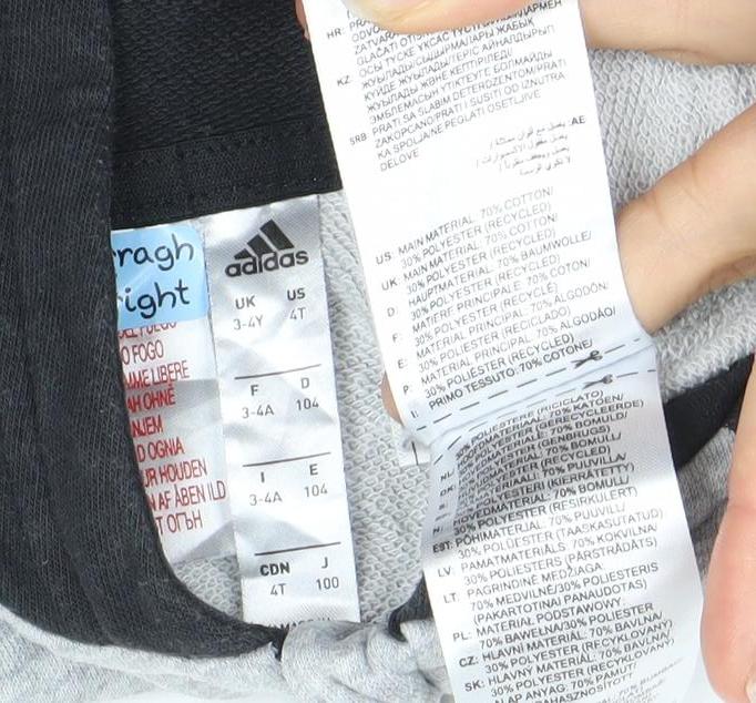 Brand and care label for Adidas boys’ grey black full zip hoodie, size 3-4, years cotton blend