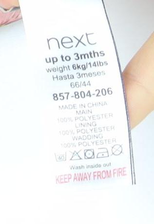 Brand and care label for Next girls’ pink floral hooded puffer jacket 0-3 months polyester lined winter coat