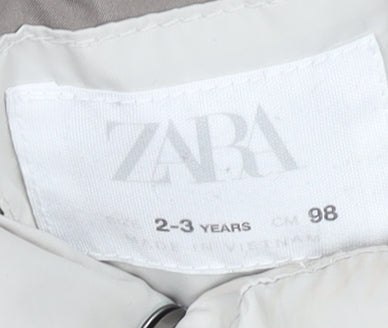 Brand and care label for Zara girls’ beige puffer jacket 2-3 years sleeveless quilted gilet