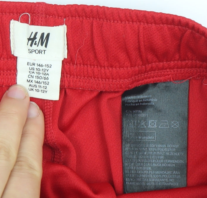 Brand and care label for H&M boys’ red athletic sports shorts 11-12 years quick dry performance