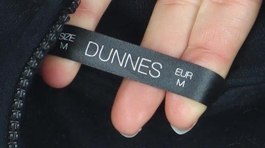 Brand and care label for Dunnes Women Black 1/2 Zip Pullover Sweatshirt, size M