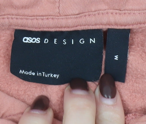Brand and care label for ASOS DESIGN Men's Pink Pullover Hoodie, size M, Fleece Casual