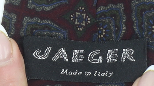 Close-up detail of Jaeger Men's Red Geometric Slim Silk Tie Made in Italy