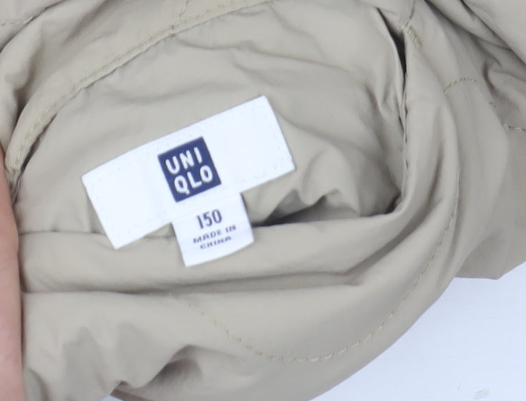 Brand and care label for Uniqlo girls’ beige quilted mid-length jacket, size 11-12, years