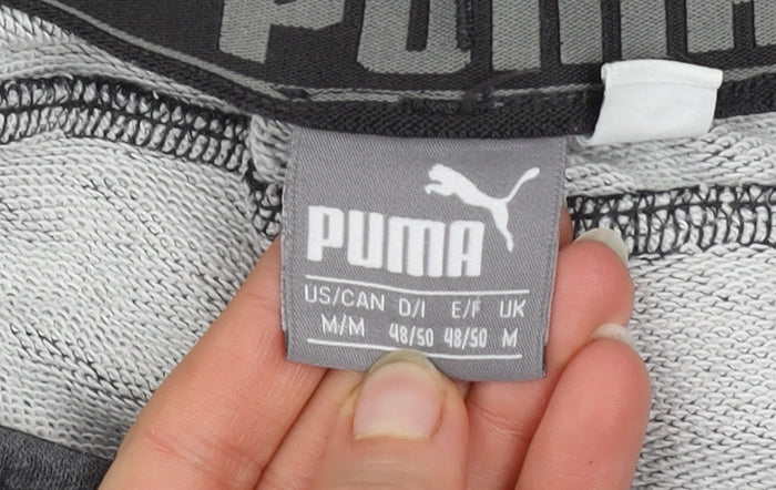 Brand and care label for Puma Men’s Grey Jogger Sweatpants, size M, Regular Fit Tapered