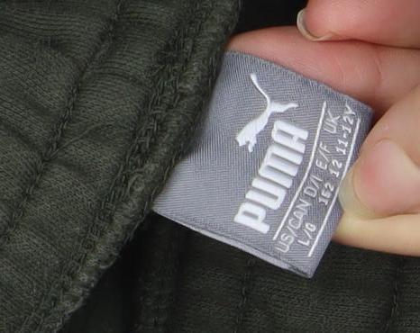 Brand and care label for Puma boys’ green jogger trousers 10 years fleece cotton activewear