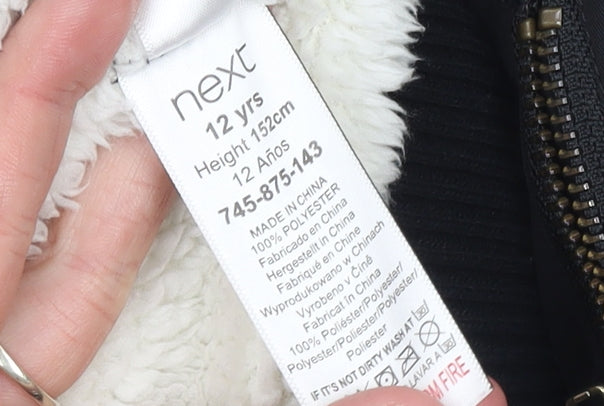 Brand and care label for Next girls’ black bomber jacket 12 years polyester lined full zip