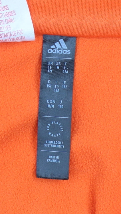 Brand and care label for Adidas boys’ orange 11-12 years 1/4 zip fleece sports sweatshirt
