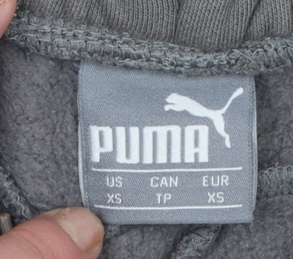 Brand and care label for Puma women’s grey xs jogger trousers with logo sports casual