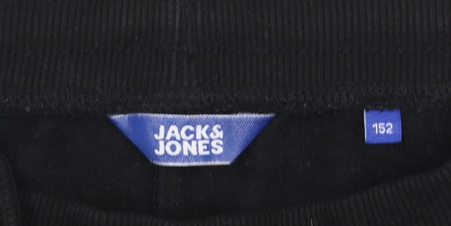 Brand and care label for Jack & Jones boys’ black sweat shorts, size 152, drawstring waist cotton blend
