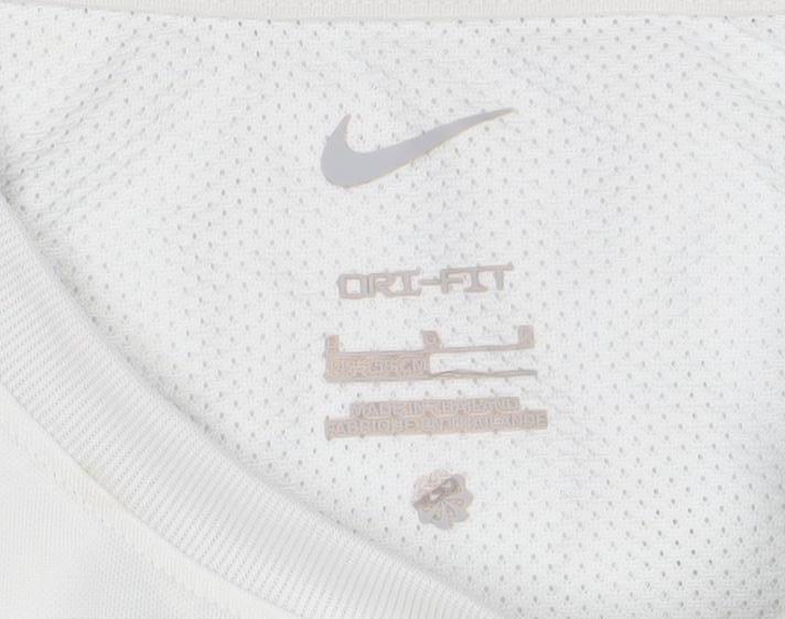 Brand and care label for Nike boys’ white dri-fit mesh sports t-shirt, size 10-11, years