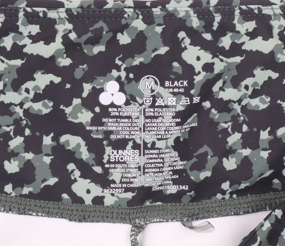 Brand and care label for Dunnes Women's Black Camouflage Leggings, size 12