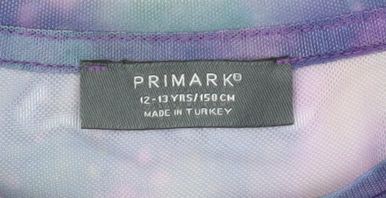 Brand and care label for Primark girls’ purple sheer galaxy long sleeve mesh t-shirt 12-13 years