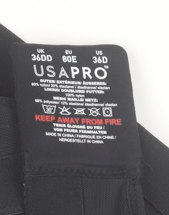 Brand and care label for USA Pro Women’s Black 36DD Sports Bra High Support Nylon Blend