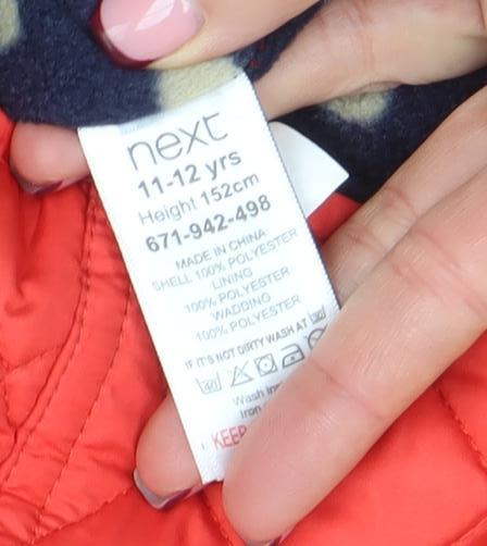 Brand and care label for Next girls’ red quilted mid-length padded jacket 11-12 years