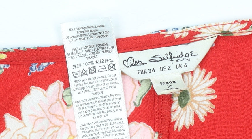 Brand and care label for Miss Selfridge Women's Red Floral Wrap Crop Blouse UK 6 Viscose