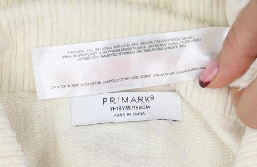 Brand and care label for Primark girls’ ivory corduroy shirt jacket 11-12 years button front