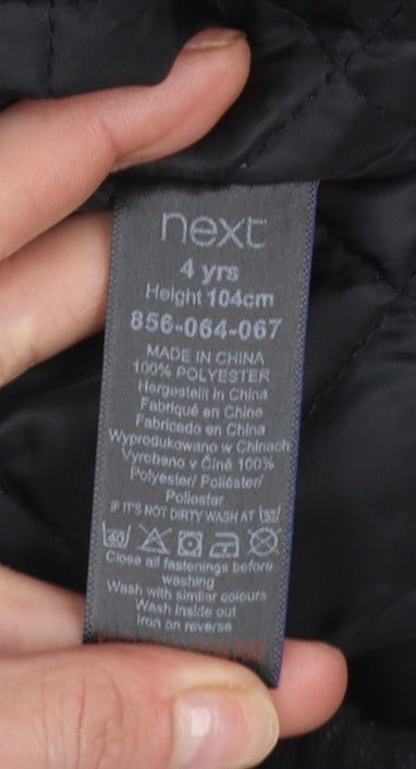 Brand and care label for Next boys’ grey hooded puffer jacket 4 years polyester lined winter coat