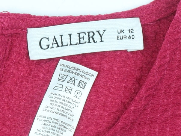 Brand and care label for Gallery Women’s Pink Long Sleeve Puff Blouse, size UK 12, Polyester