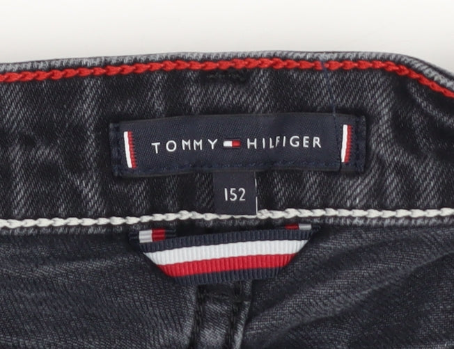 Brand and care label for Tommy Hilfiger boys’ black slim fit denim jeans, size 152, (24 in waist)