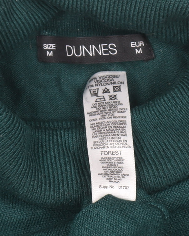 Brand and care label for Dunnes women’s green roll neck knit jumper, size M