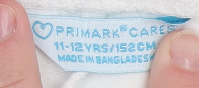 Brand and care label for Primark girls’ white 11-12 years ankle leggings cotton stretch comfort