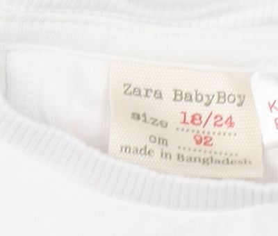 Brand and care label for Zara boys’ white long sleeve cotton basic t-shirt 18-24 months