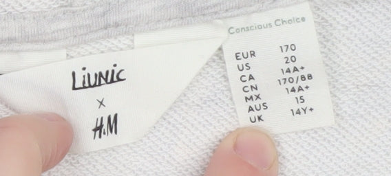 Brand and care label for H&M girls’ grey graphic sleeveless full zip hoodie 16 years