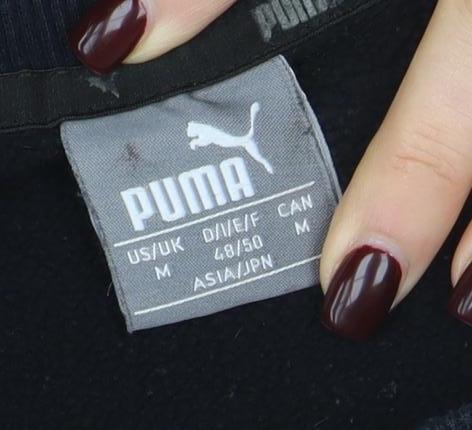 Brand and care label for Puma Men's Black Crew Neck Logo Pullover Sweatshirt, size M